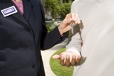 Realtor giving buyer keys to home