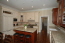 Newly remodeled kitschen with glazed cabinetry, solid cherry island, butler's pantry, granite countertops and Thermador appliances no image