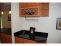 Butler pantry/wine bar in between kitchen and formal dining room. no image