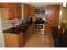 Closeup of appliances and accent tile and granite countertops no image