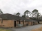 Rear exterior view with access and additional parking in rear. no image