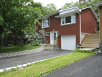 All brick bungalow with steps to main floor no image